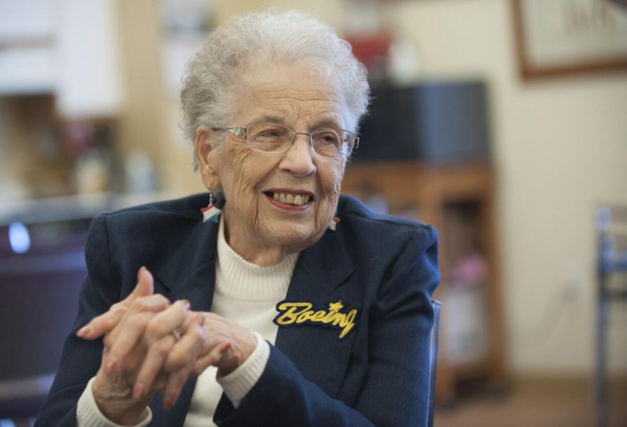 Wearing red, white and blue star-spangled earrings and an embroidered Boeing badge, Janice Rickard, 92, speaks from her Vancouver home on Tuesday about working as a Rosie the Riveter for Boeing during World War II.