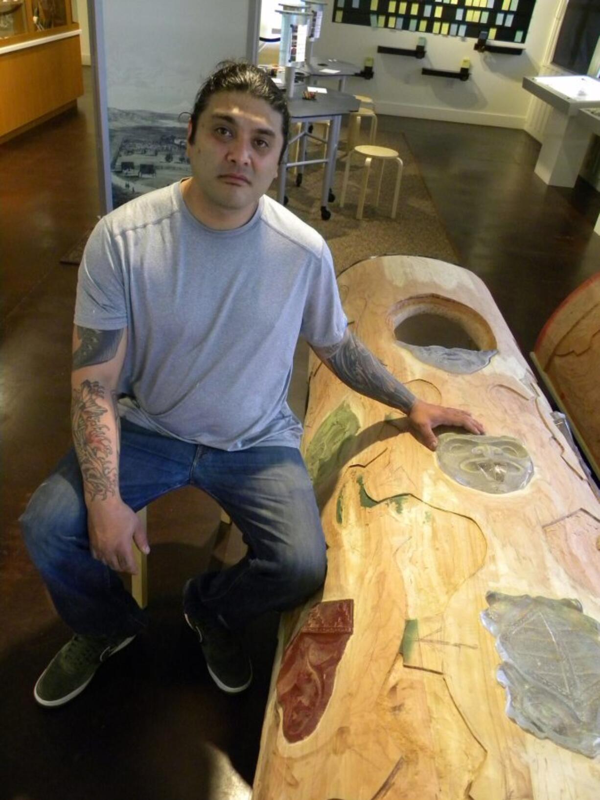 Toma Villa with his Spirit Pole before its installation Saturday in the Visitors Center.