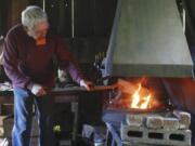 Tom Dwyer demonstrates blacksmith skills at the Pomeroy Farm Country Life Fair. Dwyer also volunteers in the blacksmith shop at Fort Vancouver National Historic Site.