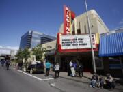 People gather outside Kiggins Theatre on Sunday as the theater celebrates its 80th birthday.