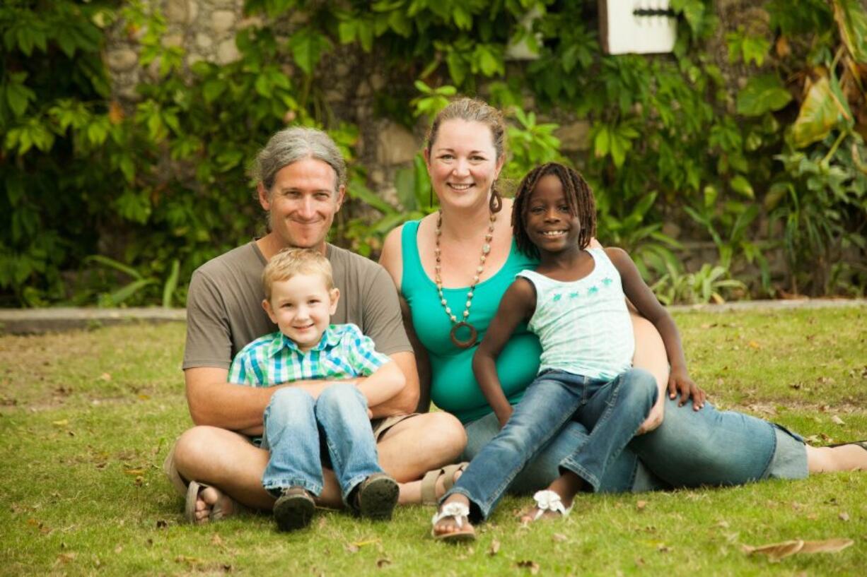 Vancouver native Chris Rolling, from left, with 4-year-old Alex, and Leslie Rolling with Olivia, 8.