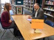 Battle Ground: Battle Ground High School senior Kinzy Christopher answers questions from volunteer and Lewis River Rotary member John Halver during a mock job interview.