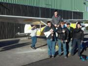 Fort Vancouver students, from left, David Richards IV, Ezra Sauer, Jasper Ham, Ben Isakov, Derek Larue and Erik Mogseth fabricated and installed aircraft tie downs at Pearson Field Education Center&#039;s hangar.