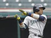 Seattle Mariners' Robinson Cano watches his ball after hitting a three-run home run off Cleveland Indians relief pitcher Cody Allen in the tenth inning of a baseball game, Thursday, April 21, 2016, in Cleveland. Franklin Gutierrez and Luis Sardinas scored on the play. The Mariners won 10-7.