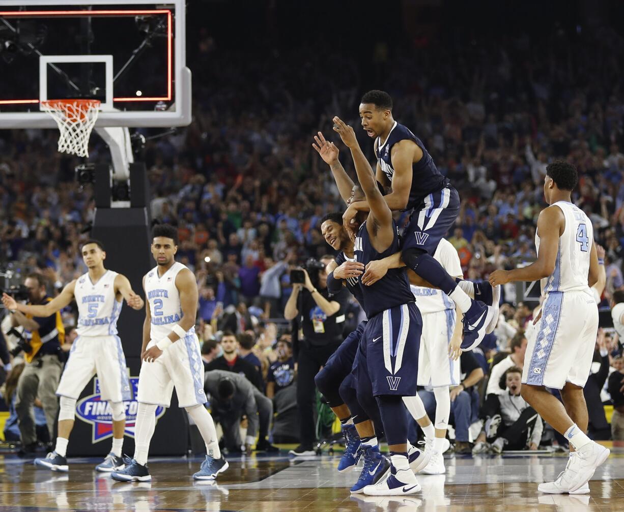 Villanova players celebrate after the NCAA Final Four tournament college basketball championship game against North Carolina, Monday, April 4, 2016, in Houston. Villanova won 77-74.(AP Photo/David J.