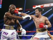 Manny Pacquiao, right, of the Philippines, hits Timothy Bradley during their WBO welterweight title boxing bout Saturday, April 9, 2016, in Las Vegas.