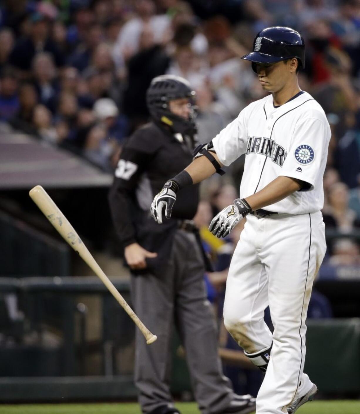 Seattle Mariners&#039; Norichika Aoki tosses aside his bat after striking out against the Oakland Athletics to end the fifth inning in a baseball game Saturday, April 9, 2016, in Seattle.