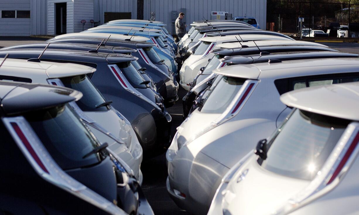 Nissan electric vehicles sit on display at an auto dealership in Roswell, Ga.