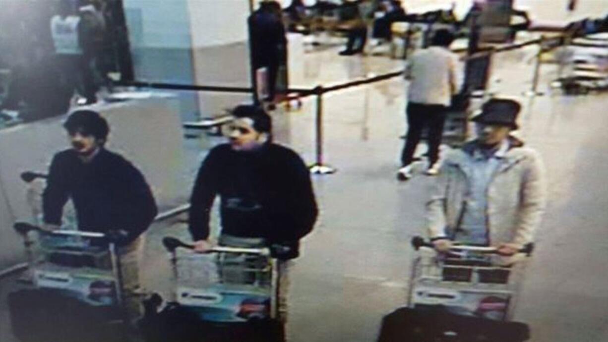 This image provided by the Belgian Federal Police in Brussels on March 22 shows three men they suspected of taking part in the attacks at Belgium's Zaventem Airport. Belgian authorities announced Saturday they had finally identified the elusive “man in the hat” spotted alongside the two suicide bombers who blew themselves up at the airport: It was Paris attacks suspect Mohamed Abrini. Belgium’s Federal Prosecution Office said the recently detained Abrini — the last identified suspect at large from the deadly Nov. 13 Paris attacks — had also confessed to being the vest- and hat-wearing man linked to the Brussels bombers whose image had been widely circulated by authorities.