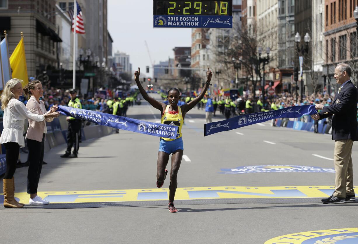 Atsede Baysa, of Ethiopia, breaks the tape to win the women's division of the 120th Boston Marathon on Monday, April 18, 2016, in Boston.