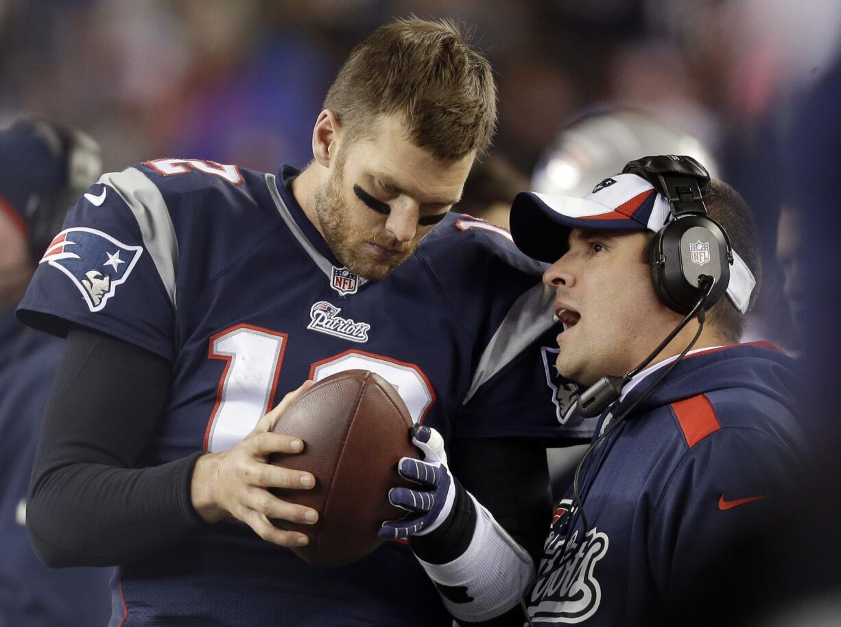 FILE - In this Nov. 3, 2013, file photo, New England Patriots offensive coordinator Josh McDaniels, right, talks to quarterback Tom Brady during the fourth quarter of an NFL football game against the Pittsburgh Steelers in Foxborough, Mass. A federal appeals court has ruled, Monday, April 25, 2016,  that New England Patriots Tom Brady must serve a four-game "Deflategate" suspension imposed by the NFL, overturning a lower judge and siding with the league in a battle with the players union.