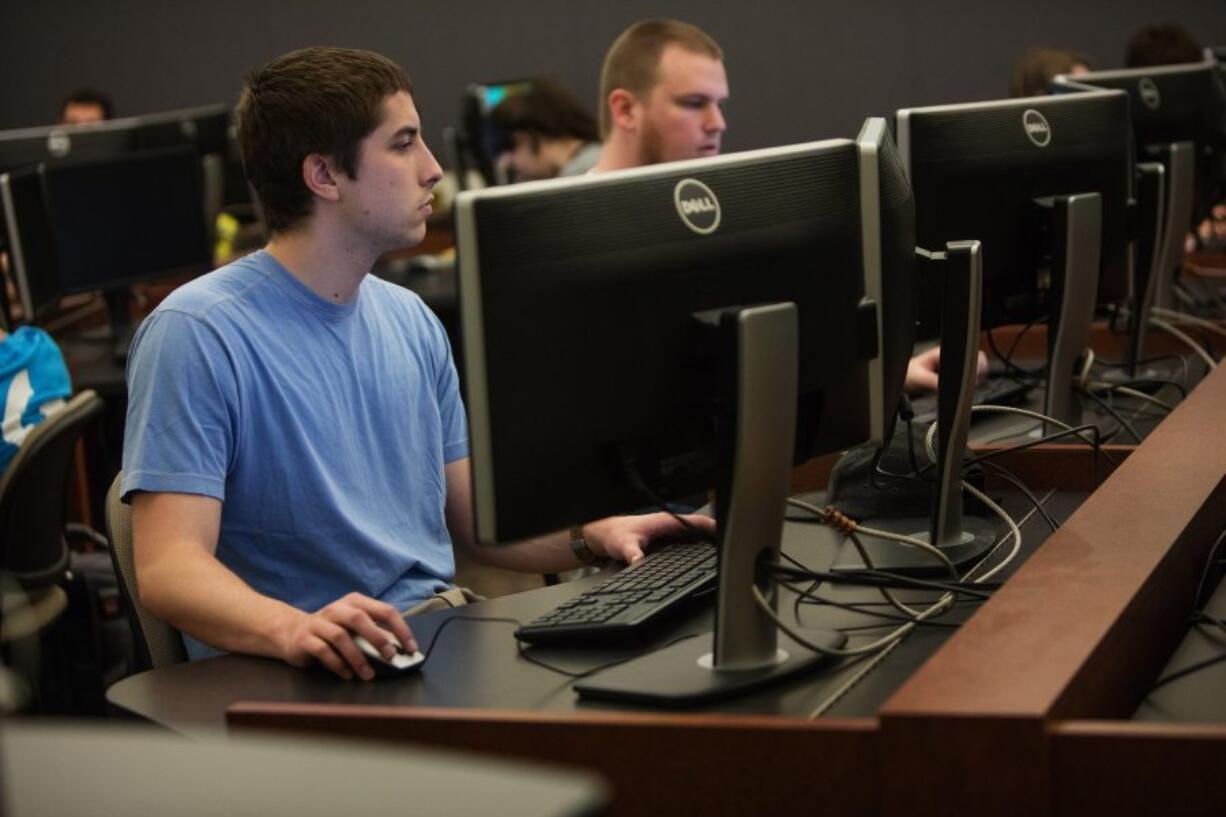 ADVANCE FOR THE WEEKEND OF APRIL 30-MAY 1 AND THEREAFTER - Jacob Shafer, a computer-science major, writes a compiler in one of the computer labs at Western Washington University in Bellingham, Wash. Shafer transferred to WWU from the University of Washington, where he worried his lack of related experience or internships would keep him out of the highly competitive computer-science program. (Steve Ringman/The Seattle Times via AP)  SEATTLE OUT, USA TODAY OUT, MAGAZINES OUT, TELEVISION OUT, SALES OUT. MANDATORY CREDIT TO:  Steve Ringman / THE SEATTLE TIMES.