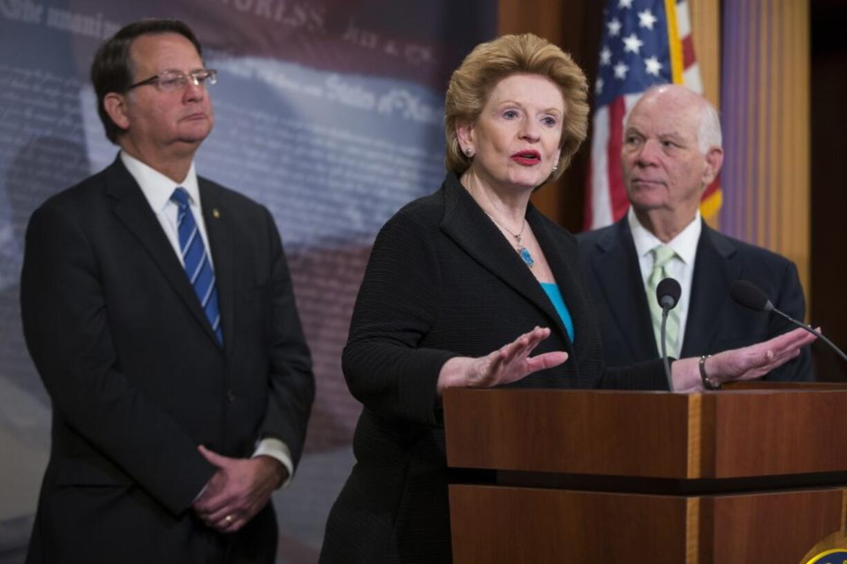 Sen. Debbie Stabenow, D- Mich., speaks during a news conference on Capitol Hill in Washington on Wednesday to discuss legislation on water infrastructure improvements. From left are, Sen. Gary Peters, D-Mich., Stabenow, and Sen. Ben Cardin, D-Md.