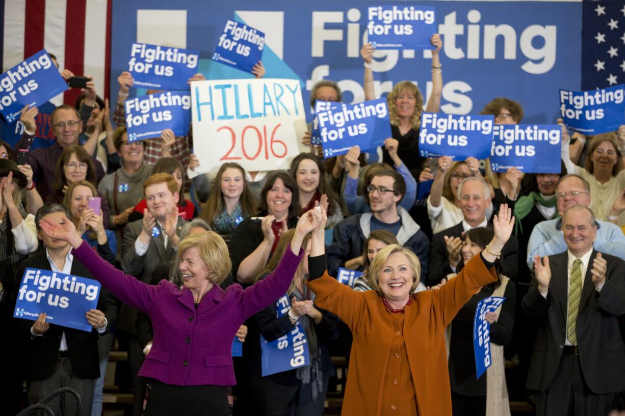 Democratic presidential candidate Hillary Clinton, right, is joined by Sen. Tammy Baldwin, D-WI, left, at a campaign event, Saturday, April 2, 2016, in Eau Claire, Wis.