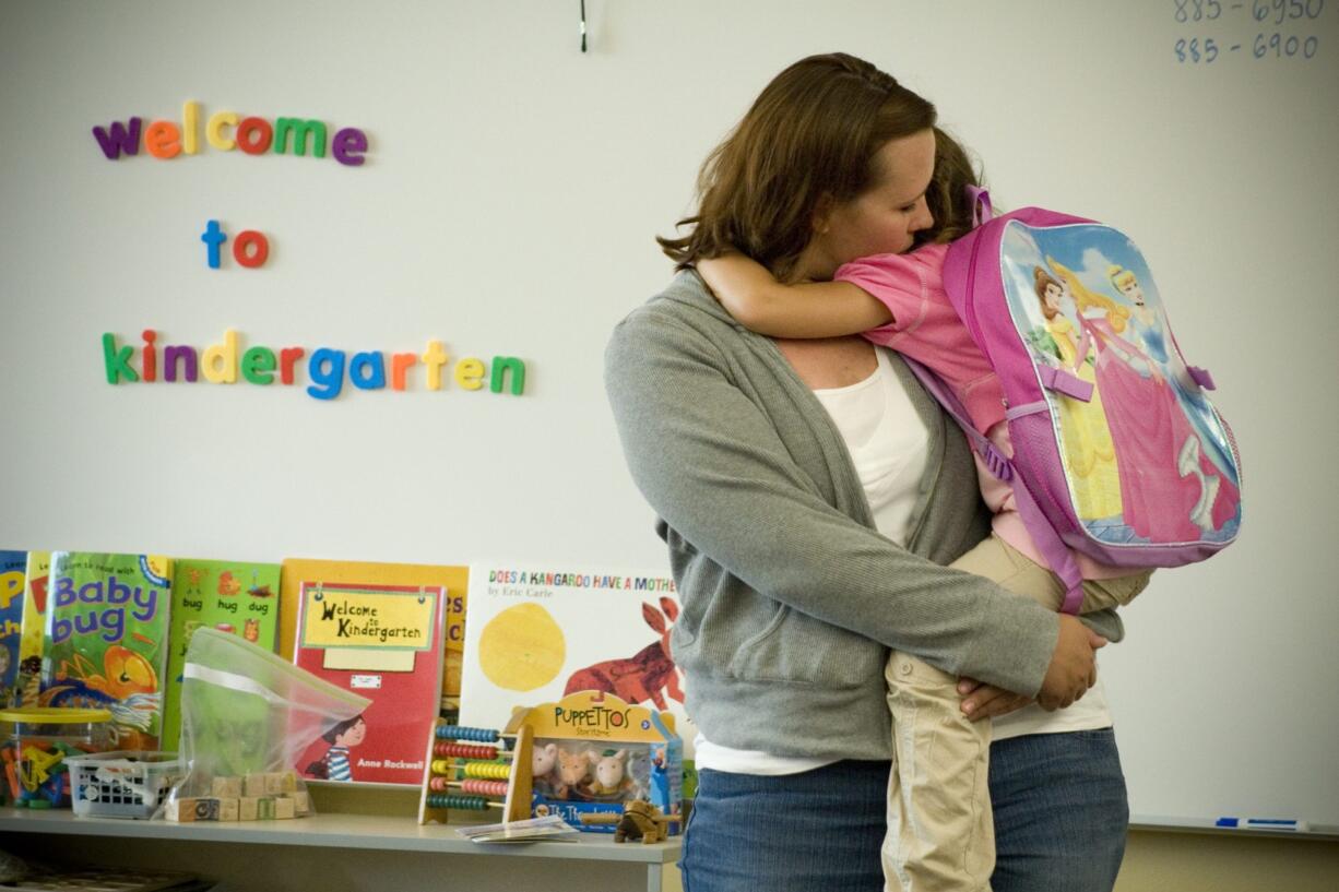 Nicole Fry drops off her niece Rylee Yarra for the first day of teacher Nora Pettebone's morning kindergarten class in September 2007 at Daybreak School in Battle Ground. Beginning in fall 2016, all Battle Ground kindergarten students will be in full-day programs.