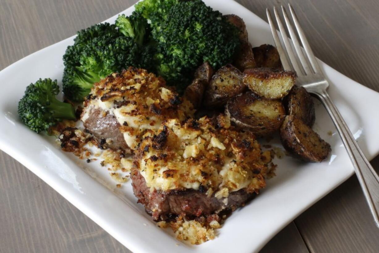 Petite steaks topped with a homemade prepared horseradish crust (AP Photo/J.M.