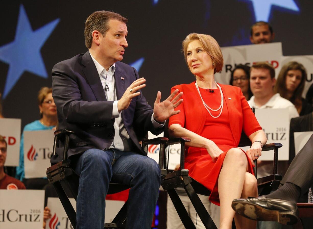 Republican presidential candidate, Sen. Ted Cruz, R-Texas speaks to Carly Fiorina in Orlando, Fla., on March 11.