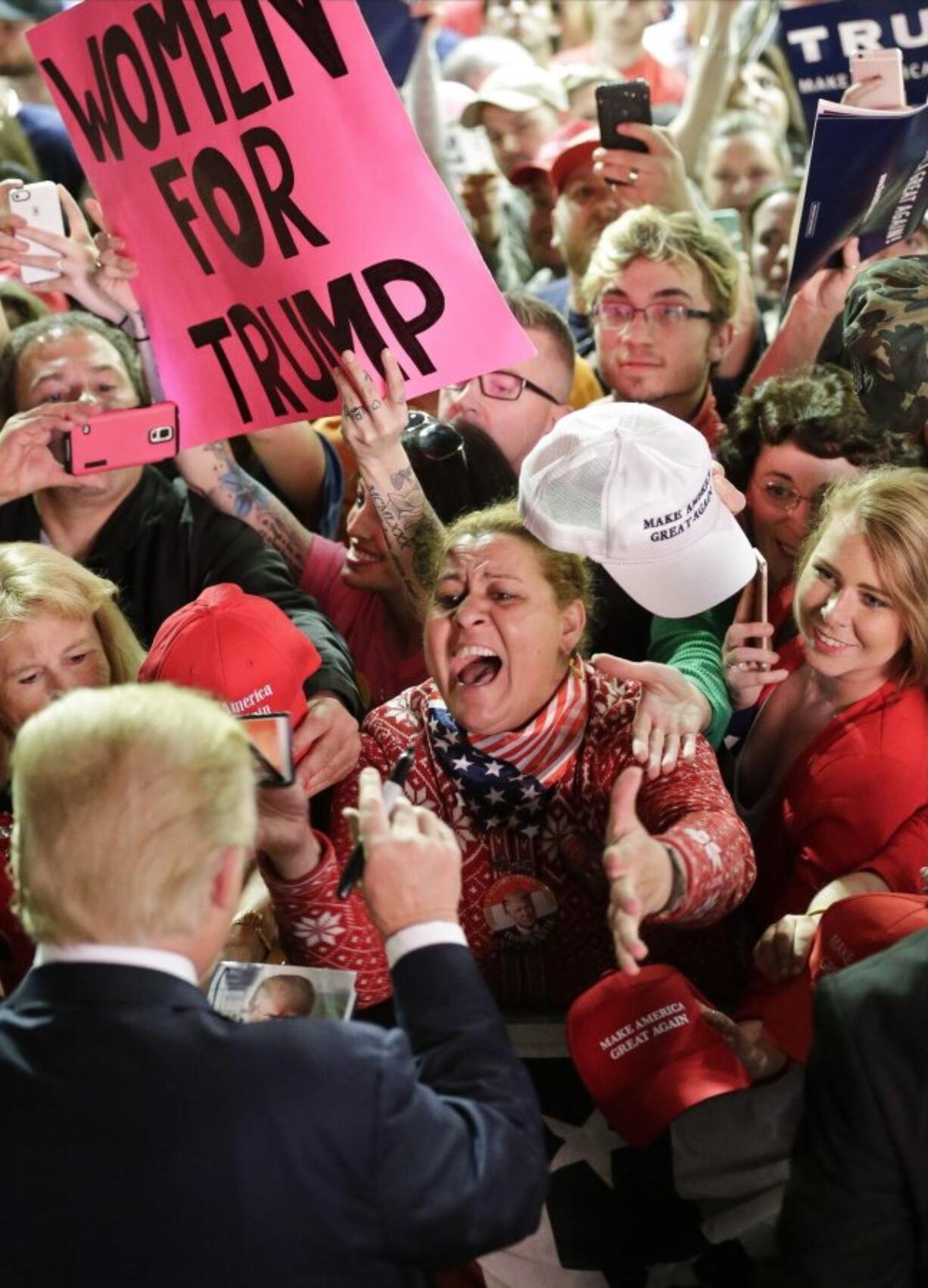 Republican presidential candidate Donald Trump, left, greets supporters at a campaign event Sunday in Poughkeepsie, N.Y.