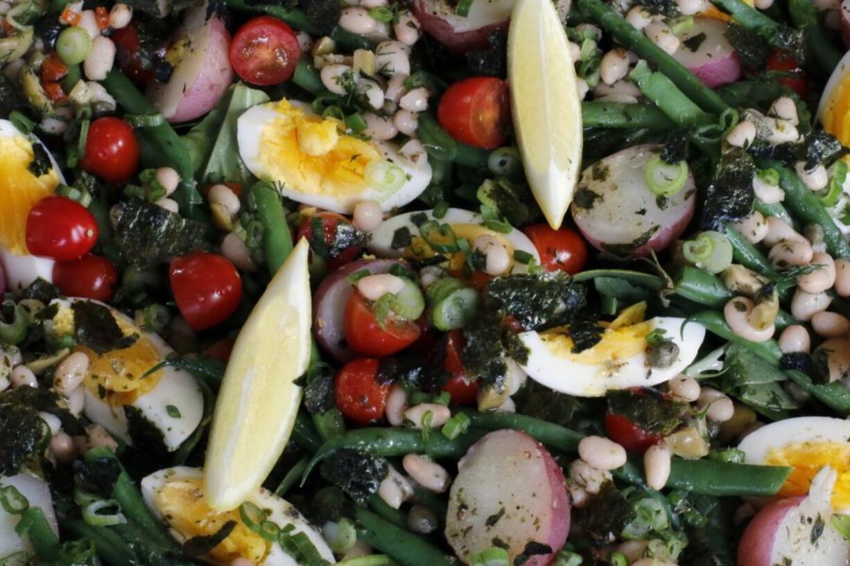 White and Green Bean Vegetarian Salade Nicoise is tuna-free version of the classic French salad. Its salty-fishy-brininess comes from capers and nori seaweed, and its protein from creamy white navy beans. (J.M.