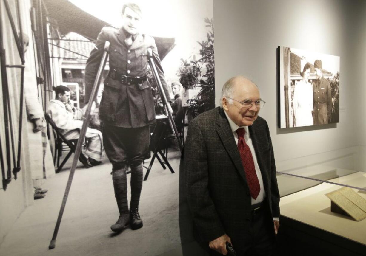 Patrick Hemingway, son of Ernest Hemingway, stands near a 1918 photo of his father in Italy while recovering from war wounds in World War I as he visits the exhibit: &quot;Ernest Hemingway: Between Two Wars&quot; at the John F. Kennedy Presidential Library and Museum in Boston.