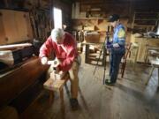 Eighth-grader Sophia Pettis, right, sets up a 360-degree camera next to carpenter shop volunteer John Miller on March 18 at Fort Vancouver. Students from Vancouver iTech Preparatory Middle School created a 360-degree virtual tour of the fort. Vancouver iTech Preparatory is one of seven schools to receive the state&#039;s Innovative Schools designation for 2016.