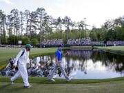 Jordan Spieth walks along the 15th fairway during the second round of the Masters golf tournament Friday, April 8, 2016, in Augusta, Ga.