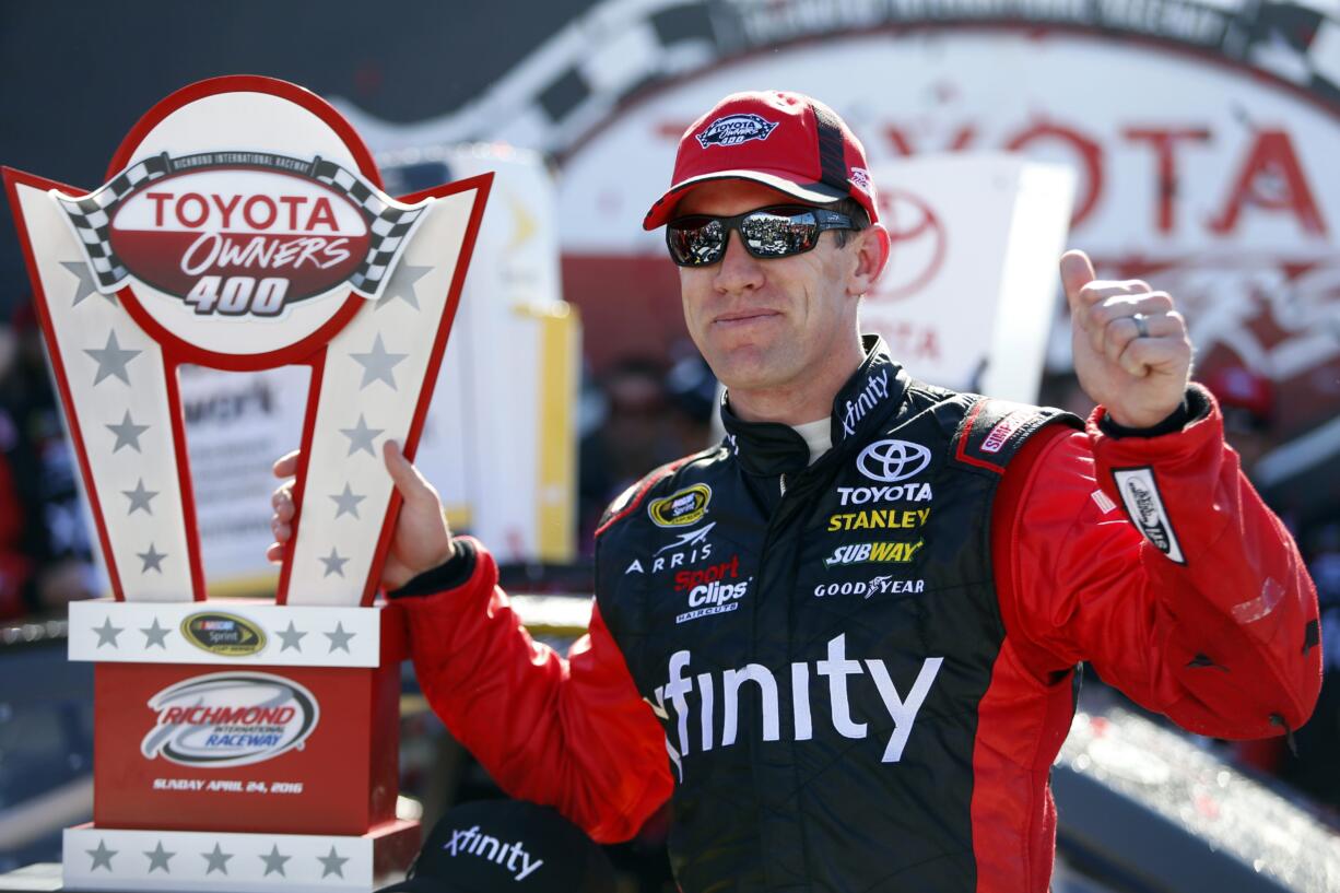 Carl Edwards with the Toyota Owners 400 Trophy after the Sprint Cup auto race at Richmond International Raceway in Richmond, Va., Sunday, April 24, 2016.