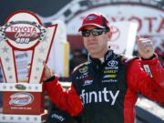 Carl Edwards with the Toyota Owners 400 Trophy after the Sprint Cup auto race at Richmond International Raceway in Richmond, Va., Sunday, April 24, 2016.