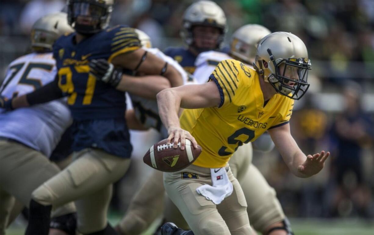 Quarterback Dakota Prukop scrambles during the Oregon Spring Game in Eugene, Ore., Saturday.