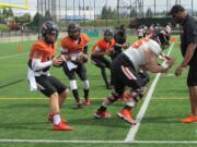 Oregon State quarterbacks Darell Garretson, left, and Marcus McMaryion practice during an spring NCAA college football training at Hillsboro Stadium in Hillsboro, Ore., Saturday, April 9, 2016. (AP Photo/Anne M.