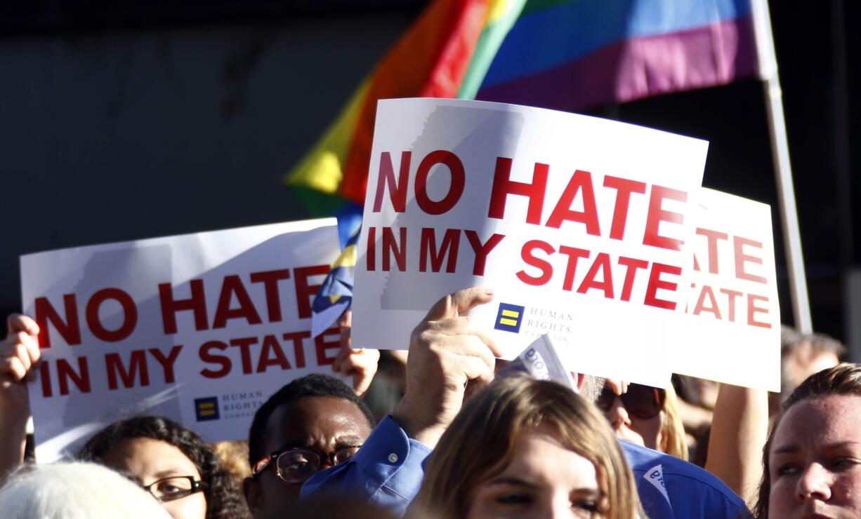 Protesters call for Mississippi Gov. Phil Bryant to veto House Bill 1523, which they says will allow discrimination against LGBT people, during a rally outside the Governor&#039;s Mansion in Jackson, Miss., on Monday. (AP Photo/Rogelio V.