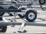 Dozens of trucks and boat trailers are parked at the Ridgefield boat launch on a warm April day, when back-ups at the launch leave people waiting to head out or return from trips.