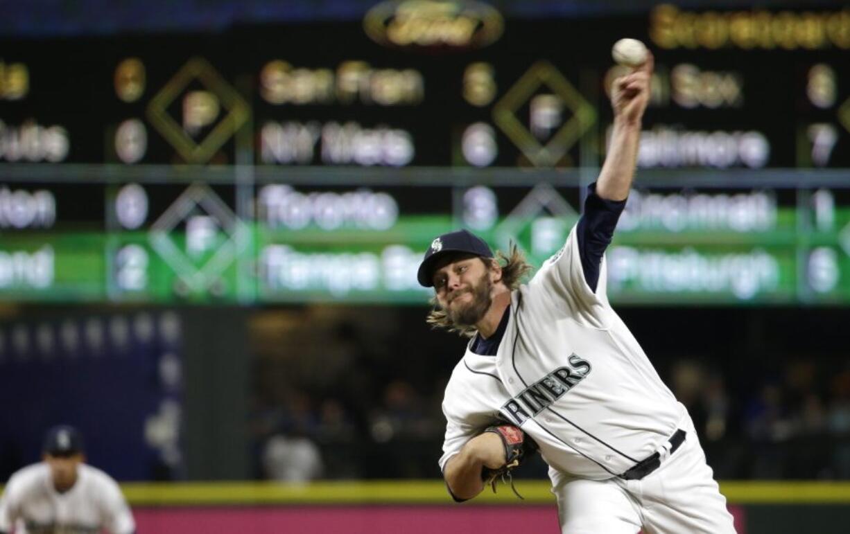 Seattle Mariners starting pitcher Wade Miley throws against the Kansas City Royals in the eighth inning of a baseball game, Saturday, April 30, 2016, in Seattle. Miley threw a five-hitter in his first career shutout to give the Mariners a 6-0 win. (AP Photo/Ted S.