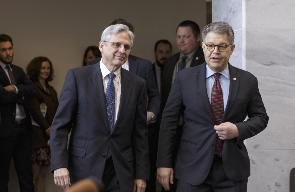 Judge Merrick Garland, left, President Barack Obama&#039;s choice to replace the late Justice Antonin Scalia on the Supreme Court, meets with Senate Judiciary Committee member Sen. Al Franken, D-Minn. on Capitol Hill in Washington on Wednesday.    (AP Photo/J.