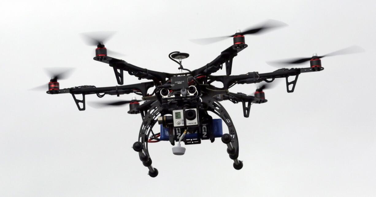 A drone is demonstrated in Brigham City, Utah. A government-sponsored committee is recommending standards that could clear the way for commercial drone flights over populated areas and help speed the introduction of package delivery drones and other uses not yet possible, The Associated Press has learned.