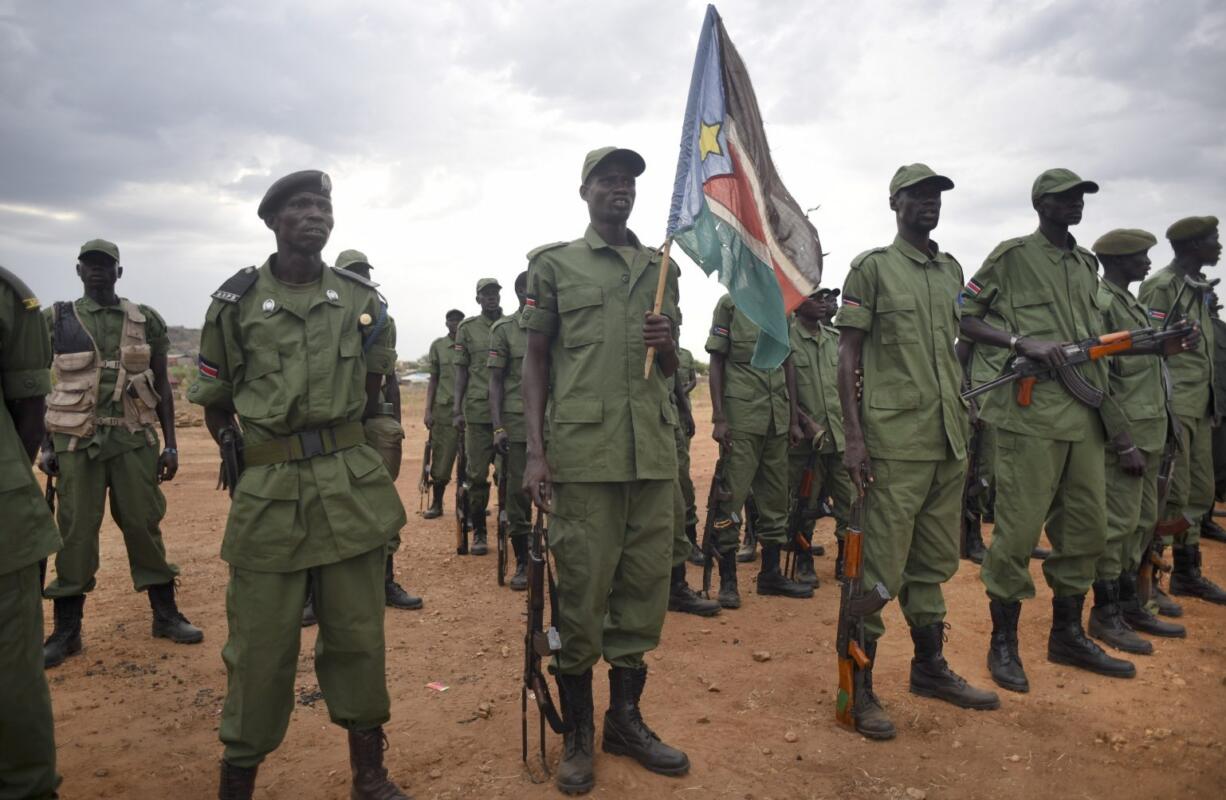 South Sudanese rebel soldiers stand to attention at a military camp in the capital Juba, South Sudan, on Thursday. South Sudan&#039;s rebels have set up camp at two designated sites in the capital as part of the process to secure the city for their leader Riek Machar&#039;s return later this month, and eventually reintegrate into the split army, after over two years of war.