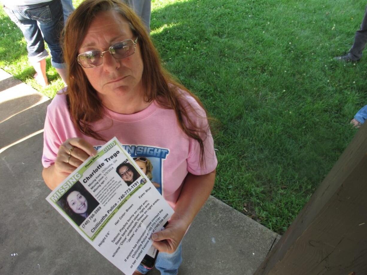 Yvonne Boggs holds a flier seeking information on her daughter, Charlotte Trego, who has been missing for more than a year in Chillicothe, Ohio. The Investigation Discovery network says it will air its first serialized drama June 6. The six-part docu-series "The Vanishing Women " will focus on six women who have gone missing or been found dead in Chillicothe, Ohio, in the past few years.