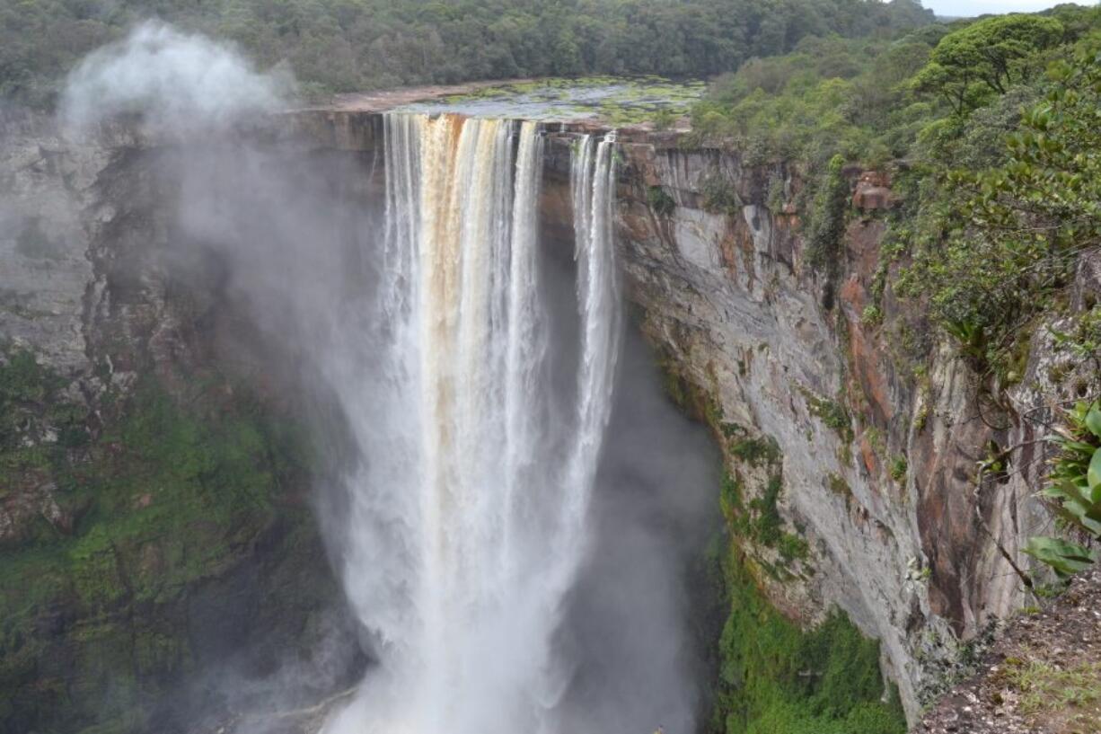 The 741-foot high Kaiteur Falls in Guyana&#039;s verdant rain forest. According to legend, the waterfall on the Potaro River was named after a Patamona chief named Kai, who paddled over it in self-sacrifice to protect his tribe from raiding rivals.