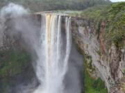 The 741-foot high Kaiteur Falls in Guyana&#039;s verdant rain forest. According to legend, the waterfall on the Potaro River was named after a Patamona chief named Kai, who paddled over it in self-sacrifice to protect his tribe from raiding rivals.