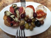 This April 5, 2016 photo shows a sample of food from Mike&#039;s Deli in the Arthur Avenue Retail Market in the Bronx borough of New York. The neighborhood is known for Italian food. (AP Photo/Beth J.