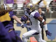 Washington's John Ross runs with the ball at the team's annual spring preview football event Saturday, April 23, 2016, in Seattle.