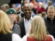 Terry Porter, center, has been named head coach of the University of Portland men's basketball team.