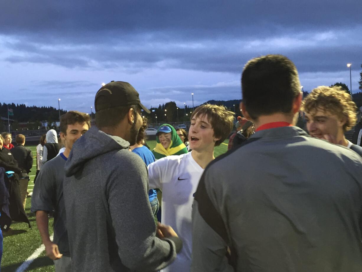 La Center's Hunter Leach, center, is congratulated after the Wildcats beat Colville 1-0 in the 1A boys soccer state playoffs on Wednesday.