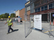 Adam Kozera of C&amp;E Rentals walks through the construction site Monday of a new Marshall&#039;s store at Hazel Dell Marketplace. The project benefited from Clark County&#039;s fee waiver program, which eliminates fees for all non-residential projects in unincorporated areas.