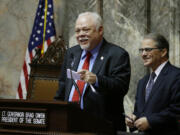 Sen. Don Benton, R-Vancouver, left, presides over the Senate at the invitation of Senate President and Lt. Gov. Brad Owen, right, March 10 at the Capitol in Olympia.