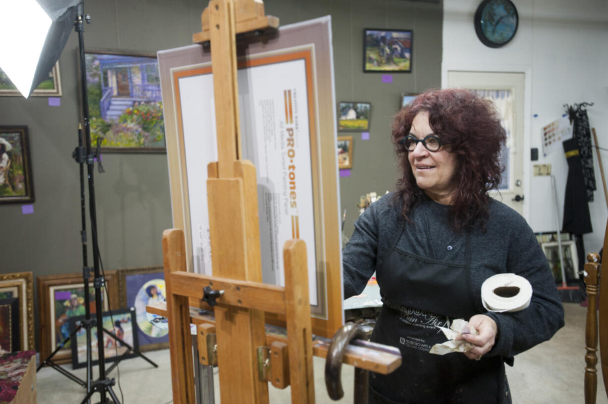 Hilarie Couture works on the &quot;Founding Mothers: Portraits of Progress&quot; project featuring 40 local women.