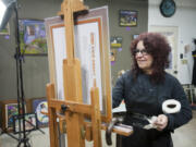 Hilarie Couture works on the &quot;Founding Mothers: Portraits of Progress&quot; project featuring 40 local women.