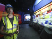 Project manager Chris Brzezicki looks at 3-D projections with which children will be able to interact while on the Ninjago ride at Legoland in Carlsbad, Calif.