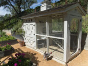 Lynda Trujillo and Christopher Schaal built this coop -- inside a fenced garden -- for their six hens.