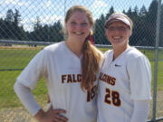 Prairie softball players Bridget Guiney, left, and Kylee Snider after the Falcons qualified for the 3A state tournament with two wins Friday at the 3A bi-district tournament in Spanaway.